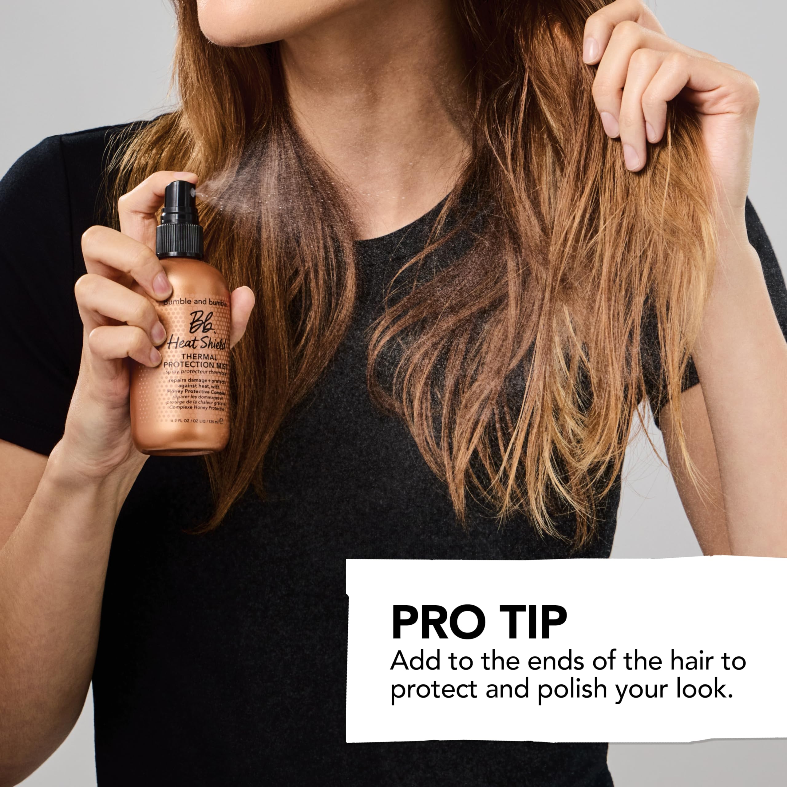 Bumble and bumble Heat Shield Mist 450°F for hair styling, showing the spray bottle with clear label and nozzle.