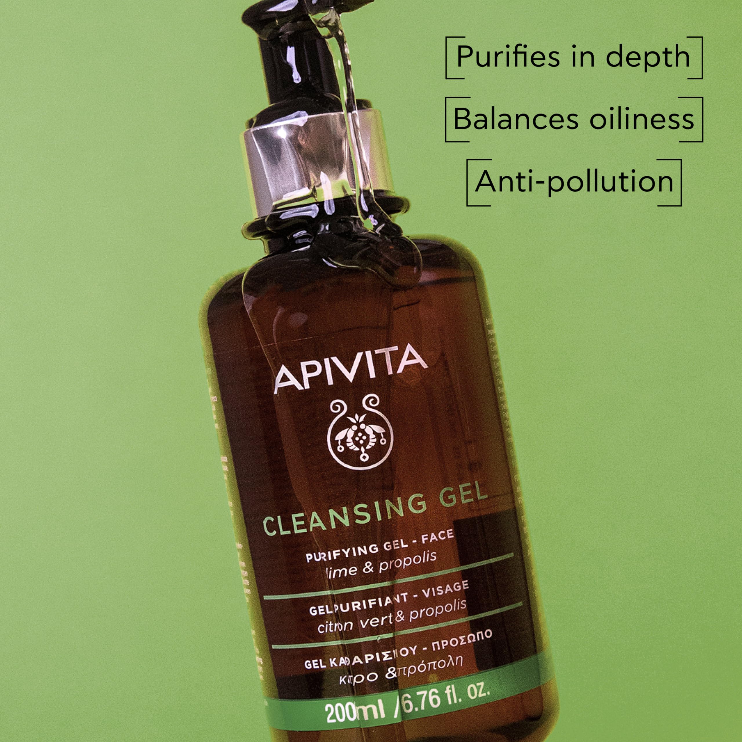 Apivita Purifying Gel Lime & Propolis facial cleanser with fresh lime slices and Propolis extract in a clear bottle.