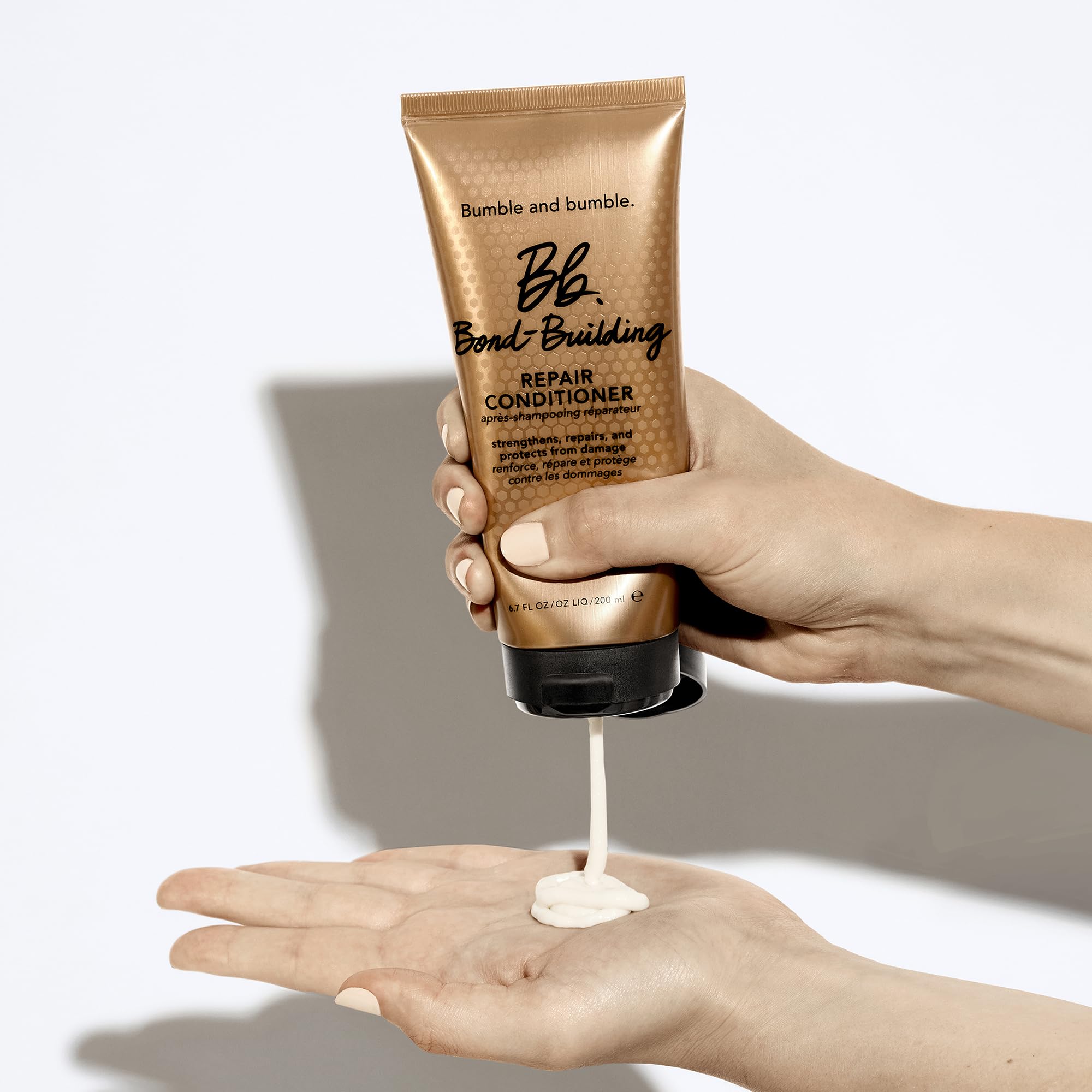 Bumble and bumble Bond-Building Repair Conditioner 6.7oz bottle, creamy conditioner for damaged hair, with brand logo visible.