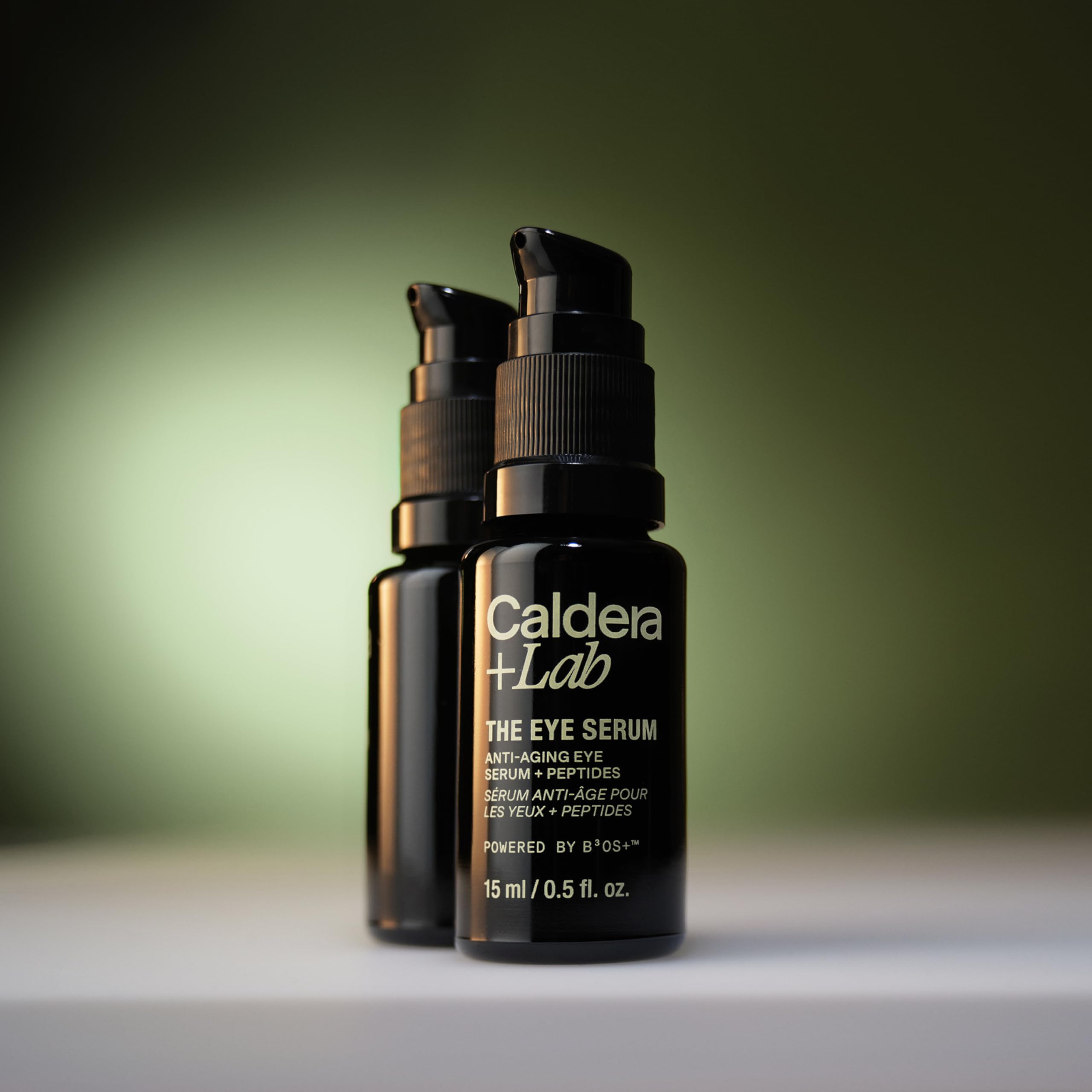 Caldera + Lab The Eye Serum, a men's anti-aging peptide eye serum, shown in a sleek bottle with applicator tip.