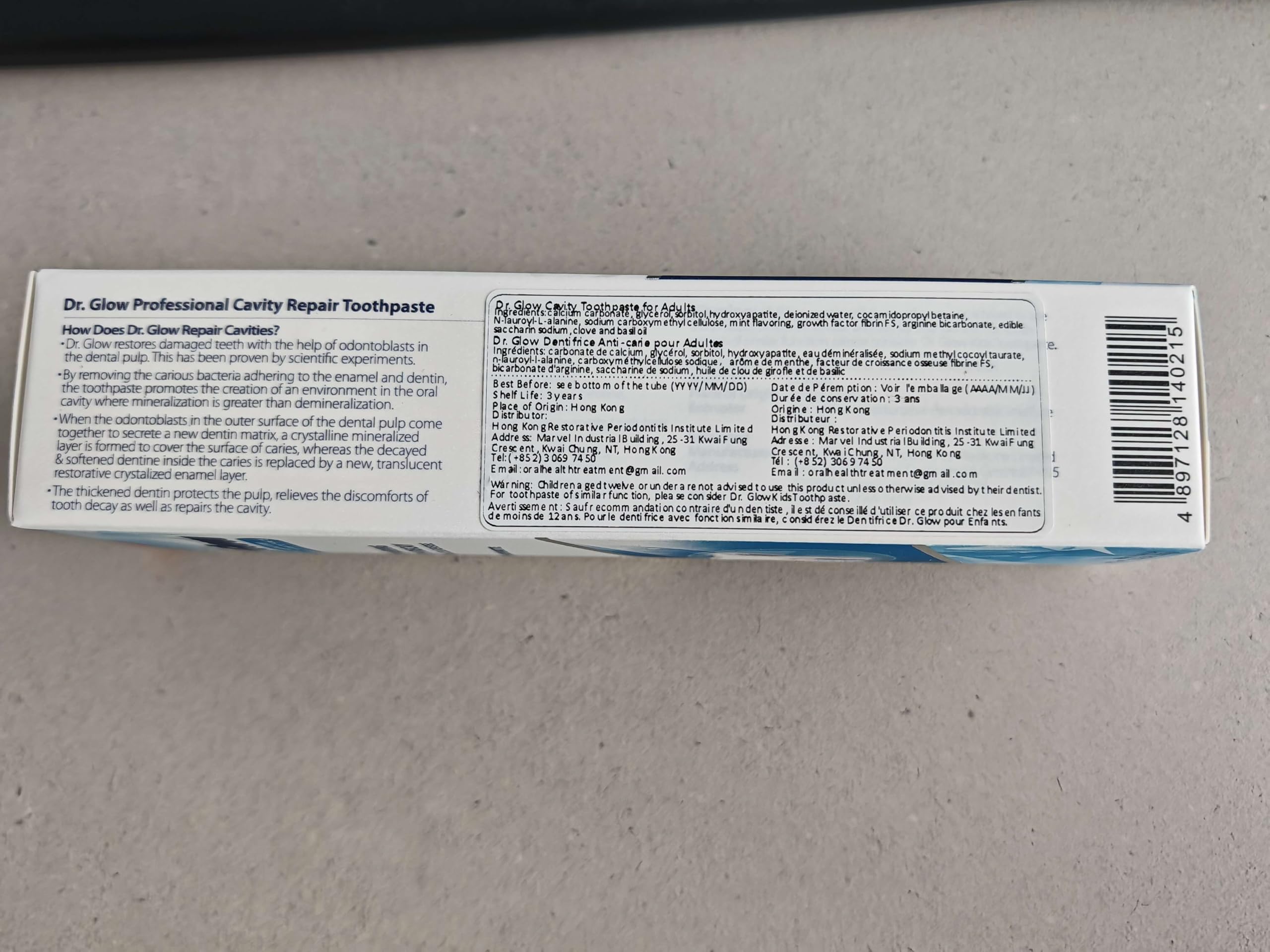 Dr. Glow Cavity Repair Hydroxyapatite Toothpaste tube showing white packaging and product label for oral health.