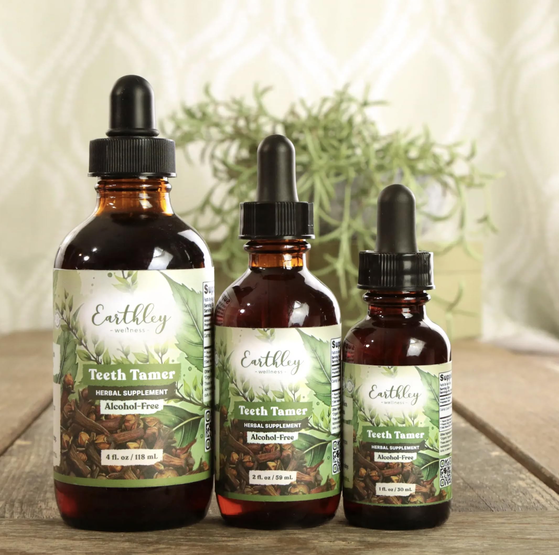 Earthley Wellness Teeth Tamer organic herbal supplement for teething relief, featuring natural ingredients in a labeled bottle.