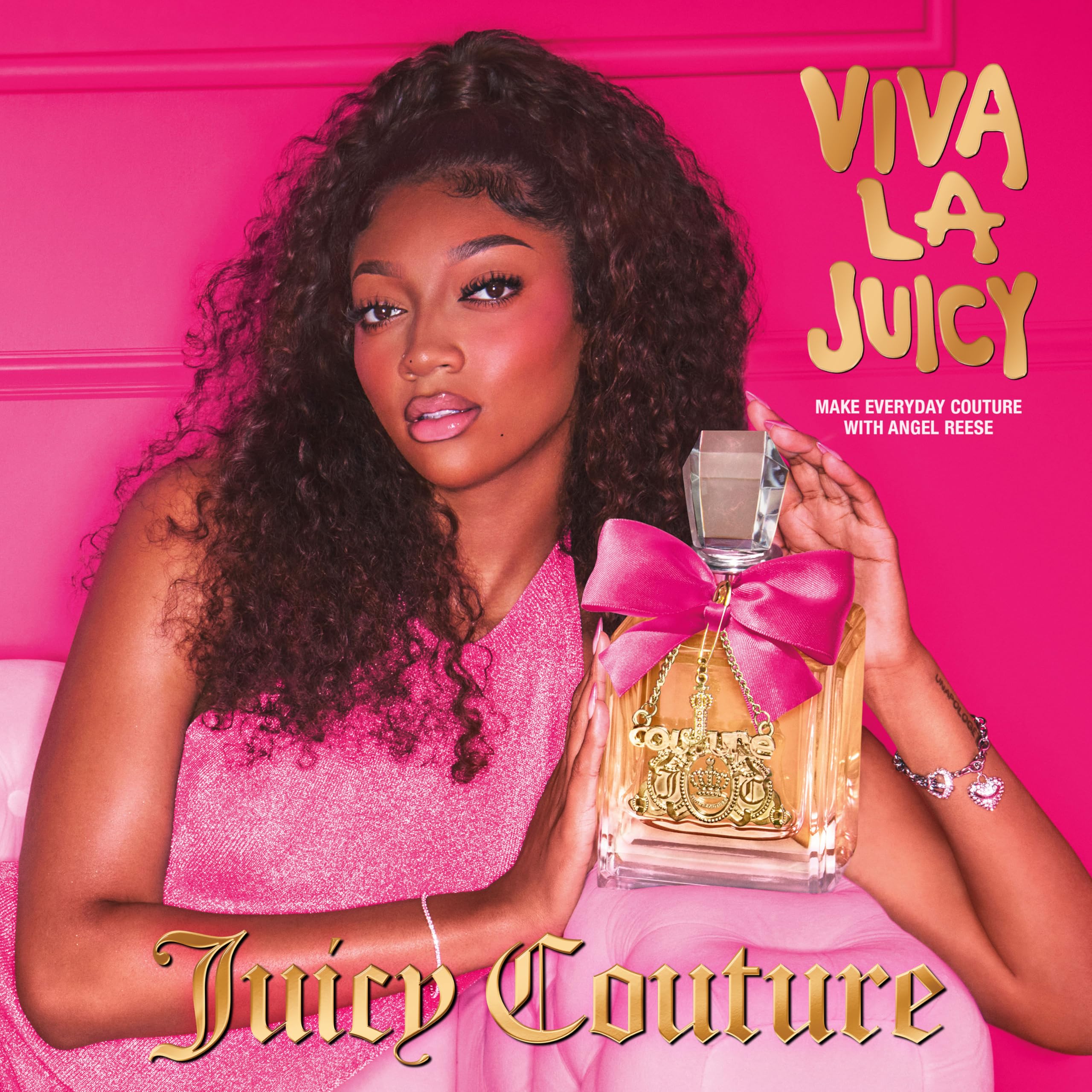 Juicy Couture Viva La Juicy EDP spray for women, elegant perfume bottle with pink and gold accents.