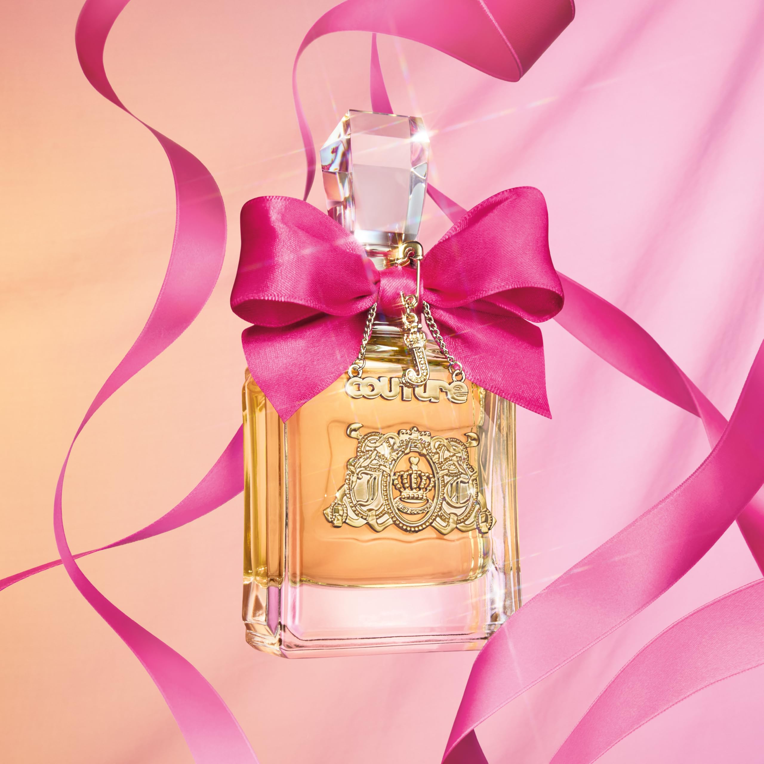 Juicy Couture Viva La Juicy women's EDP spray bottle with elegant packaging, showcasing the personal fragrance for women.