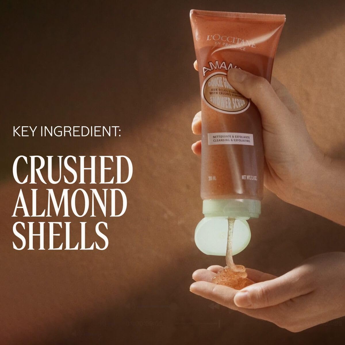 L'Occitane Almond Shower Scrub 2-in-1 exfoliating body wash with almonds and creamy texture, designed for smooth, refreshed skin.