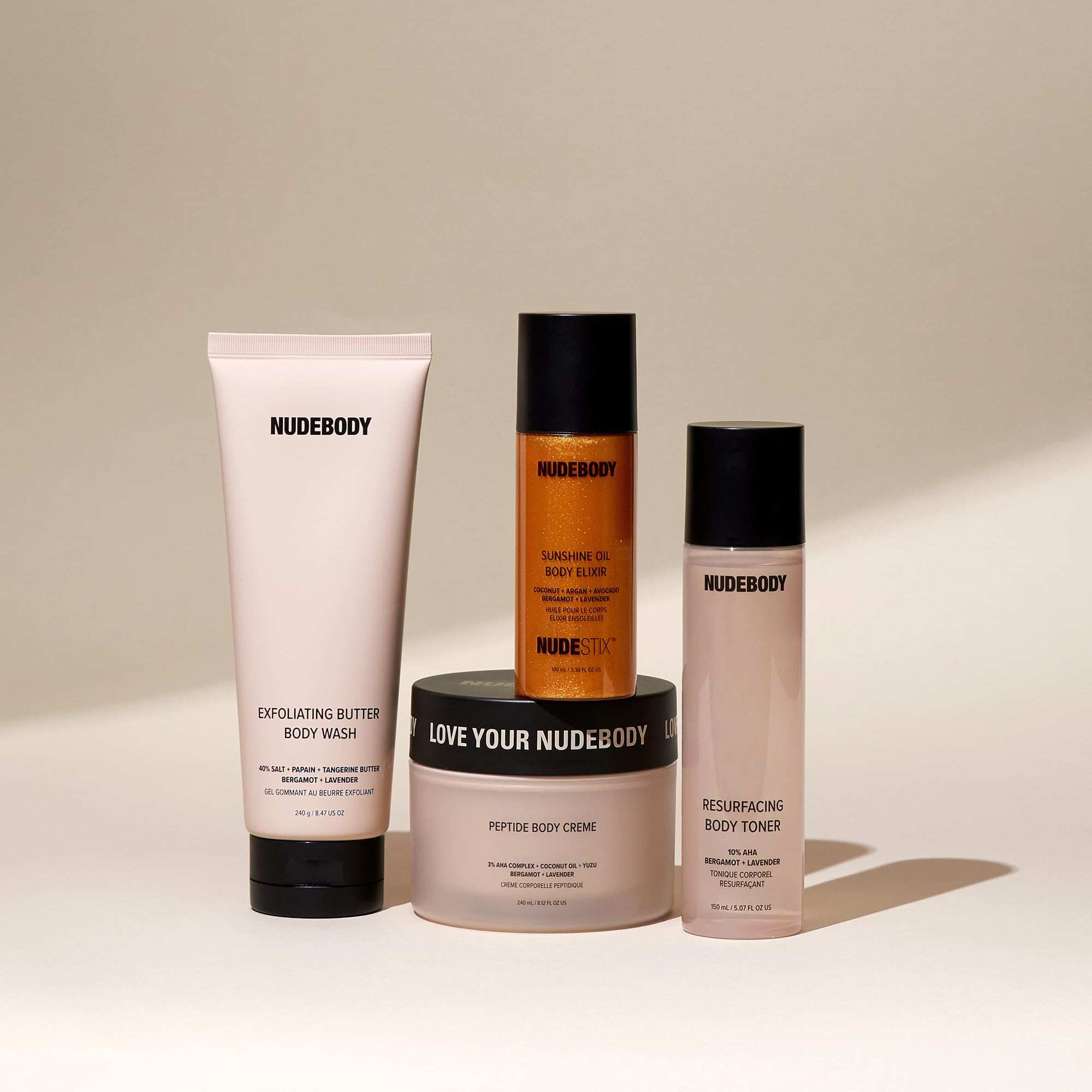 Nudestix Sunshine Oil Body Elixir with shimmer, moisturizing skin, and gradual tan for a luminous, glowing finish.