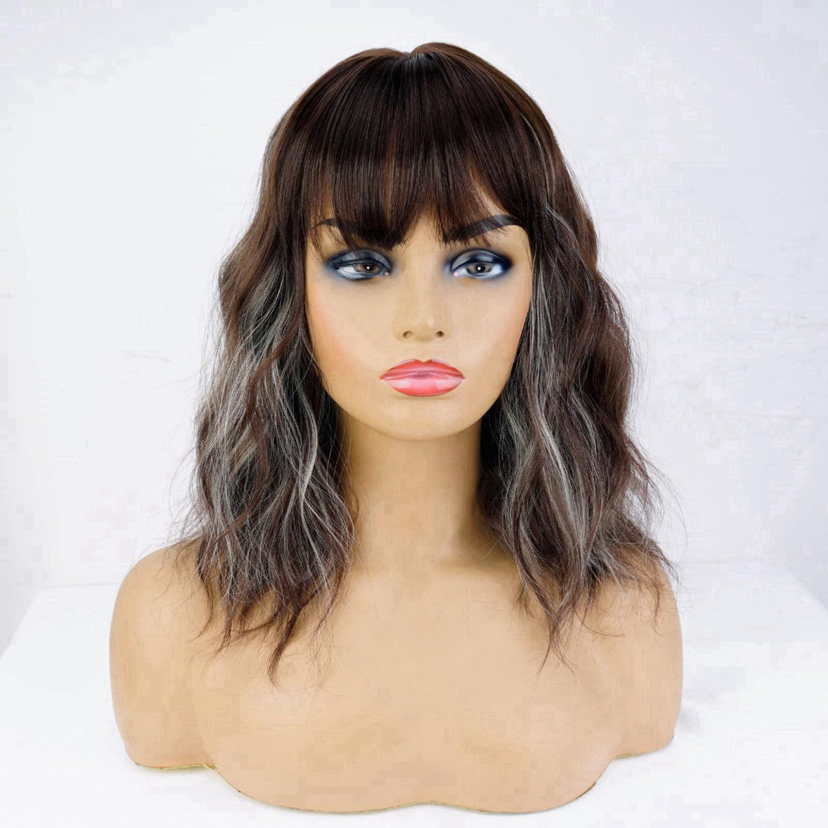 andromeda Brown Mixed Blonde Short Bob Wavy Wig with Bangs for women – close-up detail in Brown Mixed Blonde