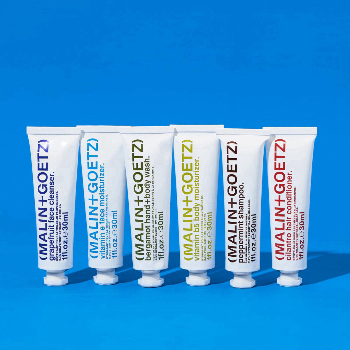 MALIN+GOETZ Best-Sellers Travel Kit | Six Everyday Essentials for Face, Body + Hair | Grapefruit Face Cleanser, Vitamin 