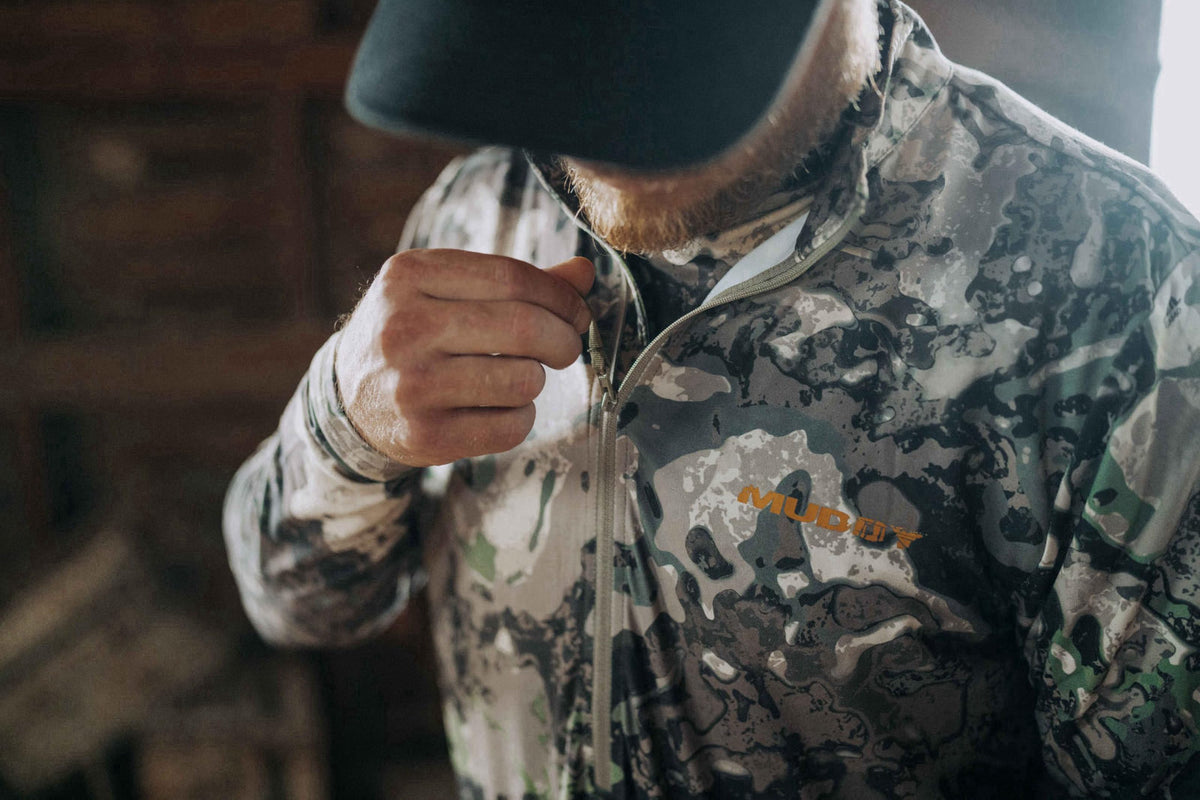 Muddy Men's TRX Lightweight Quarter Zip Shirt – full view, size Chest (in) Waist (in) Hip (in) Sleeve Length (in)