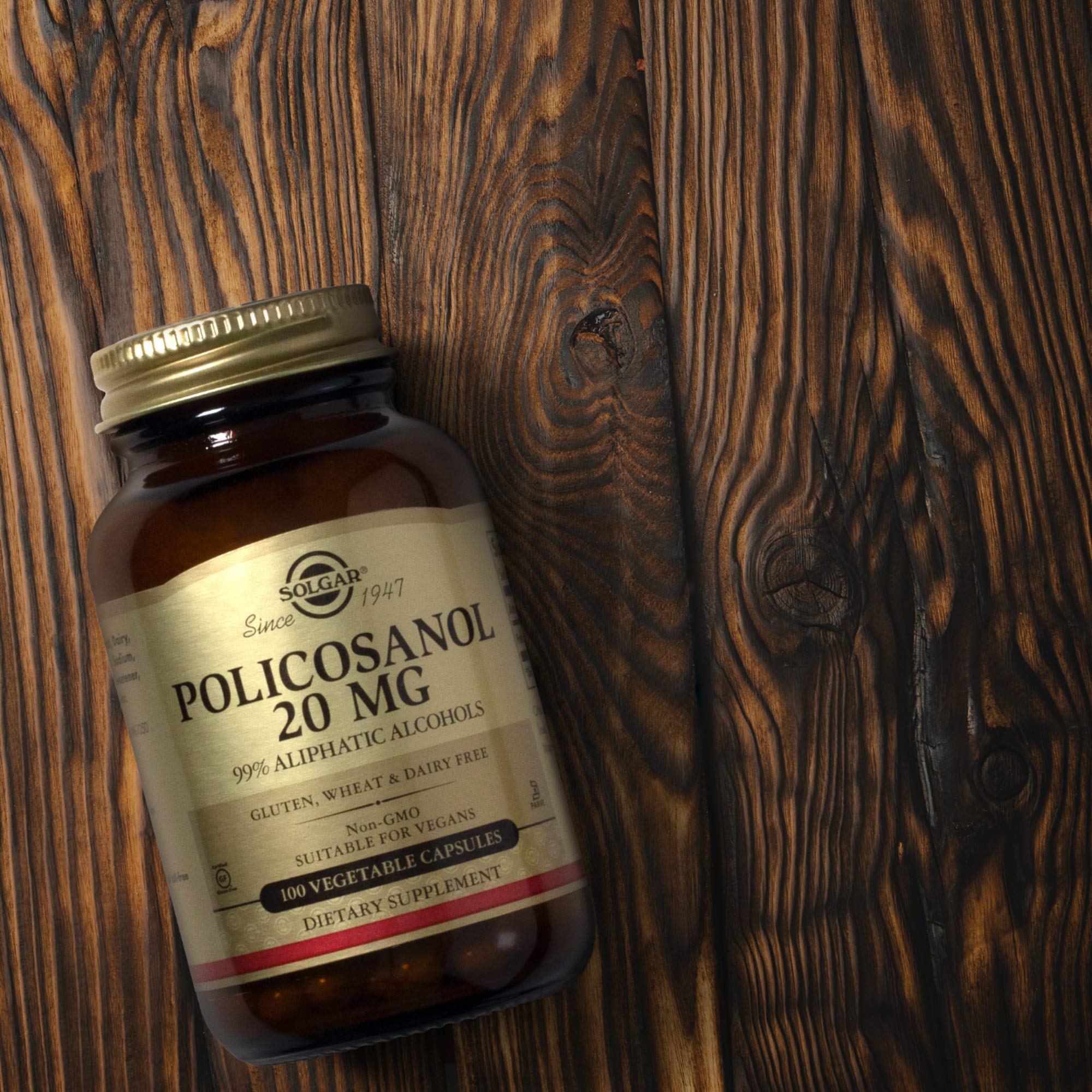 Solgar Policosanol 20mg nutritional supplement in 100 vegetarian capsules for heart health, shown in this product image.