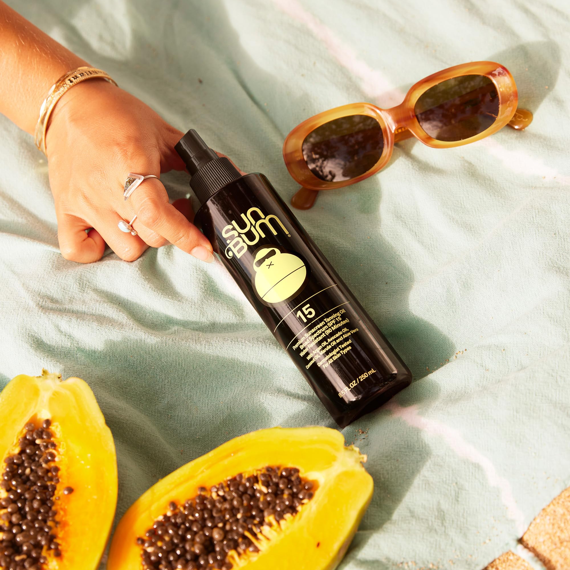 Sun Bum SPF 15 Moisturizing Tanning Oil in 8.5oz bottle, featuring a clear bottle and Sun Bum branding for smooth, sun-kissed skin.